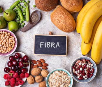 Products rich in fiber. Healthy diet food. Fruits, beans, berries, bread, oatmeal, chia and nuts Top view